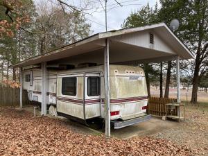 Great Views! 2 Lots totaling 1.8 Acres +/- backing right up to the very popular Shoal bay State Park! This 1988 London Aire 40 foot Camper is FULLY LOADED and ready for the next family! With 2 separate RV hookups, Septic and a covered pavilion set up perfectly for your next camping trip.