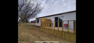 Home and 2 Acres M/L with a pond and privacy.