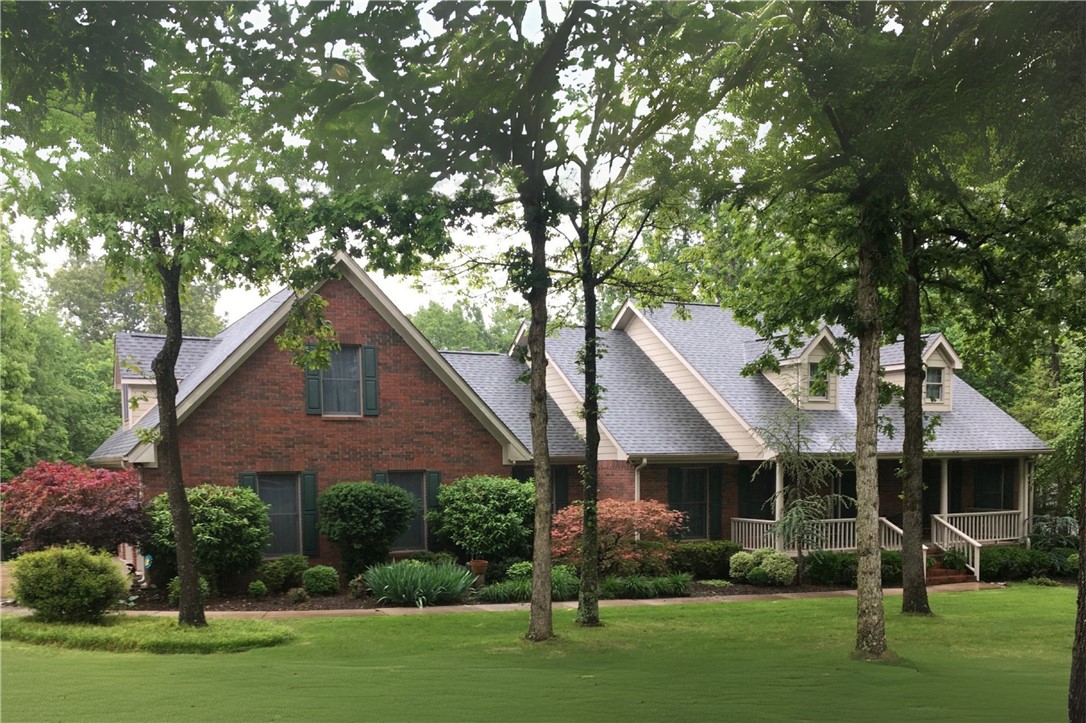 Nestled in the Doubletree Estates, this custom-built 4-bed, 3-bath home sits on a spacious 1.49-acre lot in one of Fayettevilleās most beautiful & established neighborhoods. Known for its walkable, friendly atmosphere & tree-lined streets. Built with quality & attention to detail, the home features 2x6 exterior walls, real hardwood floors, & stunning natural light throughout from its gorgeous windows. High ceilings enhance the open feel, & built-ins are thoughtfully included in multiple rooms. A wood-burning fireplace w/ a gas starter adds a practical touch to the main living area. The primary suite includes a large walk-in closet, dual vanities, & a spacious layout. Upstairs, youāll find a bonus room, 4th bedroom, & an additional bathroom. The oversized garage offers ample storage w/ shelving, a workbench, & a conveying oven. Enjoy the inviting covered front porch, perfect for taking in the neighborhood charm. The covered back porch with beadboard ceiling and fans, overlooks a beautifully established yard.