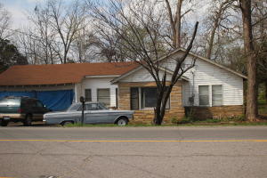 Currently rental unit but is zoned commercial. House has 1204 sq ft per tax assessment. 150 feet of street frontage.