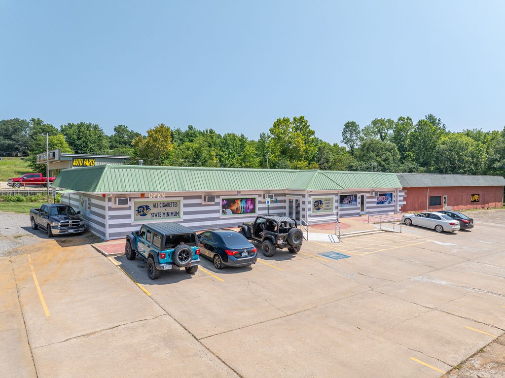 12,000 square foot Income Producing property, strategically located on prime highway frontage just off I-40 exit in Alma. Fully operational smoke shop w/drive thru averaging $65 K a month gross revenue. 75 % new interior renovations with updated plumbing and electric with private and commercial restrooms.
Located on 1.4 acre lot with room to expand . Business and Inventory included. Three separate spaces : retail, office suites & warehouse. Cash flowing flexible use asset. Ideal for investors or owner operator with immediate cash flow.