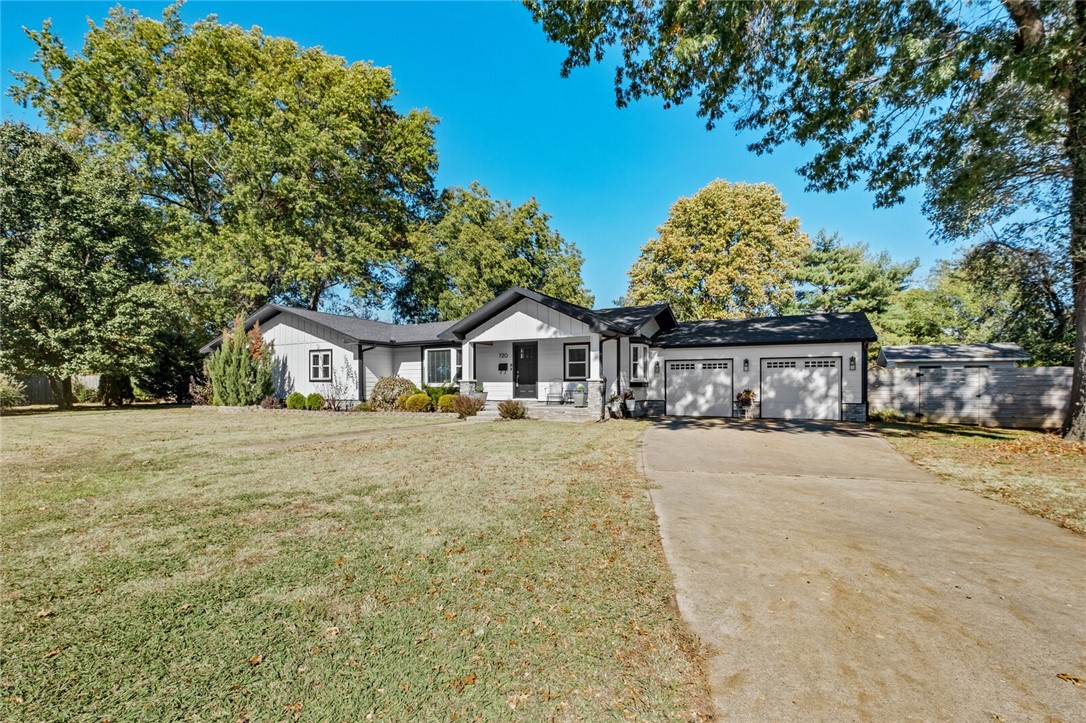 Taken all the way to the studs for a remodel that was completed in 2018, this remarkable home is the downtown listing you've been waiting to see. Everything was new in the remodel: roof, windows, cement siding, sheetrock, HVAC, tankless water heater, floors, cabinets, and so so much more. Look at those interior pictures! And how about the size of that backyard! Plenty of room for a pool or an ADU. Upon walking into the front door you are greeted with an open concept living room, kitchen, and dining area. This is the ideal hosting space with a commercial size double refrigerator, ice maker, large island, and double ovens. Take a couple steps down to a second living room with a cozy fireplace that leads out to a wonderfully flat and spacious backyard that is hard to find in a downtown listing. Four Bedrooms/Two Bathrooms. Amazing primary bathroom with large shower and tub. All of this on a private cul de sac with mature trees and only a mile to the Bentonville square and close to the mountain bike trail system.
