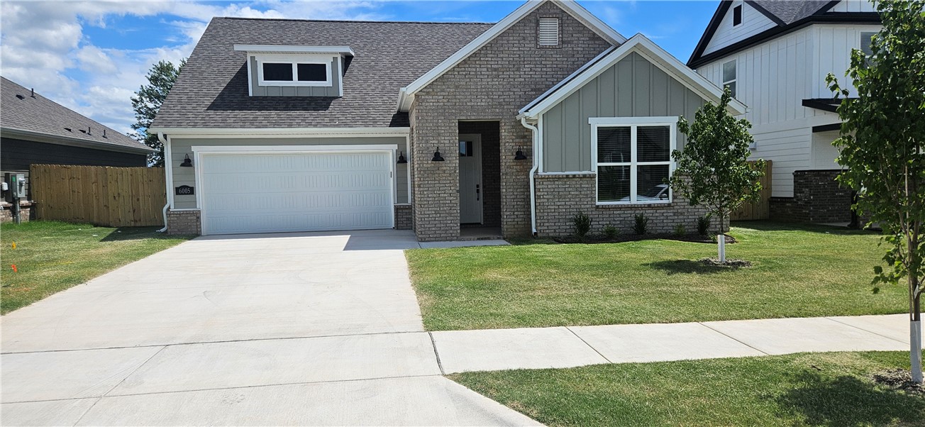 Nice new construction home in Osage Hills neighborhood. Emmet plan features 4 bedrooms, 3 full bathrooms, linear electric fireplace in the living room, LVP flooring throughout the main living areas and primary bedroom, quartz countertops and more. Chef's kitchen boasting Frigidaire stainless steel appliances, gas range, pantry, quartz countertops, bar pull handles and large island, all complemented by gorgeous backsplash. Luxurious primary bedroom features abundant natural light, while the spa-like primary bathroom offers a walk-in shower, tub, double sinks, and spacious walk-in closets. Additional features include a secondary bedroom downstairs, two large bedrooms upstairs and a separate laundry room. Nestled on a generous lot with covered patio that overlooks the serene sodded, fully fenced backyard.