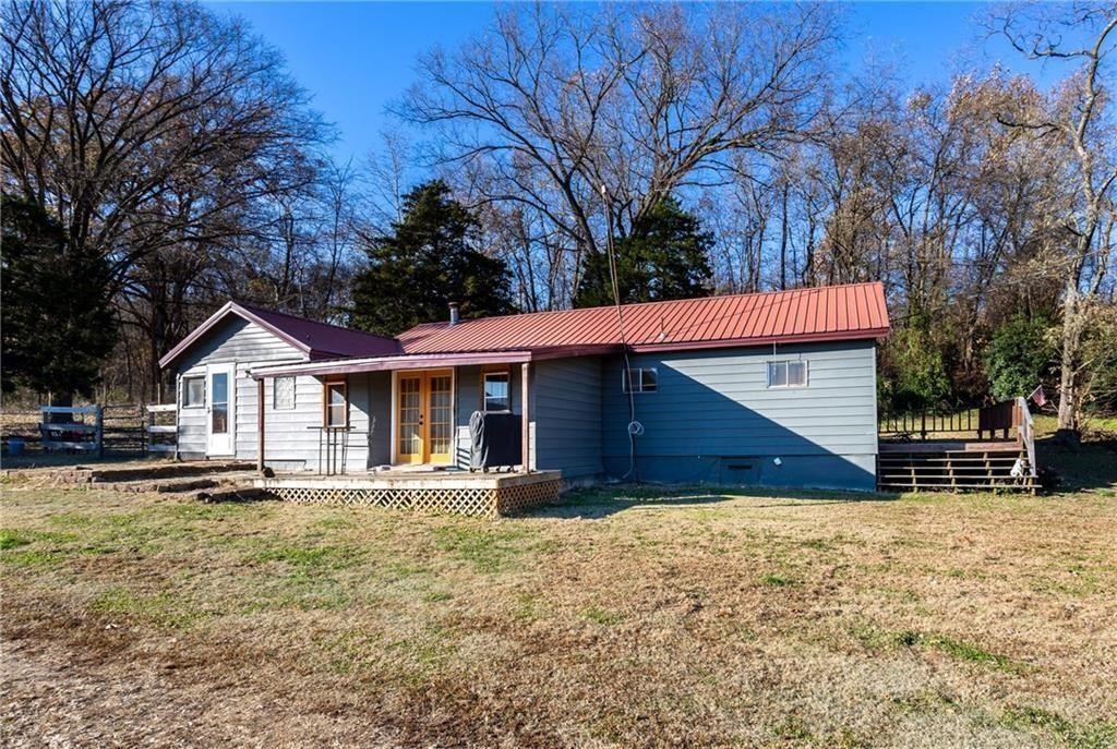Sit back and enjoy the view of this home and 10 acres. You will love the quiet time here where you can soak up natures beauty. Next winter you will want to cozy up to the pellet stove in this 3 bed 2 bath home. The home has several updates,(new vinyl plank flooring in the kitchen, new carpet in the dining & master bedroom) and is looking for its next loving family. The shop/barn is nice and it is ready to house your next project. When you step out of your car here, make sure you listen.....that is called tranquility!