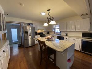 Spacious five bedroom, three bath home. Tons of storage space, large front and fully fenced in back yard. Nice big kitchen with large island. Fireplace in the family room. Half basement with storage room. This home is great for a large or growing family.