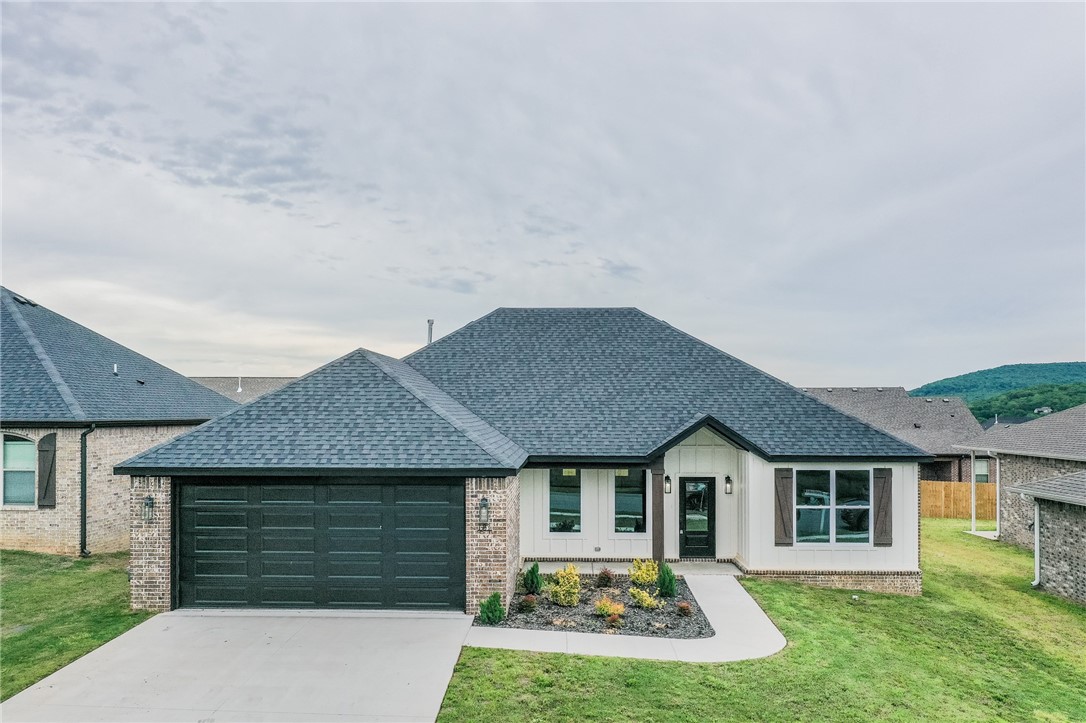 New Construction and priced below market value!! This 3 BR/2BA with open-split floor plan hosts a beautiful color scheme with all the extras. The primary bedroom opens into a spa-like bathroom with a huge walk-in tiled shower, a soaker tub, and double sinks with a huge walk-in closet and laundry complimenting the suite. Enjoy entertaining family and friends in the great room with a vaulted ceiling and beams in the sitting area and granite countertops and beautiful lighting complimenting the kitchen and dining areas. A spacious pantry and huge built in hall tree are a couple of the extras that make this home so special. The backyard is fully fenced to offer privacy to enjoy the covered patio. Don't miss all this beautiful home has to offer located in a Mountain View Estates S/D and only a short distance from Fayetteville. Call today for your private showing.