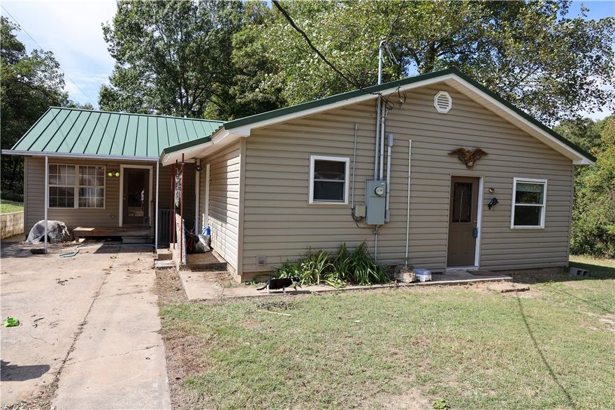 Motivated seller offering $20K buyer credit for upgrades/repair, interest rate buy down, or housing costs! Many upgrades and improvements were made in 2023. Fridgeaire kitchen appliances convey. Apple and pear trees. Awesome shop with 12' doors. Pallet rack can convey if needed. Central access to anywhere in NWA. Private, country setting.
