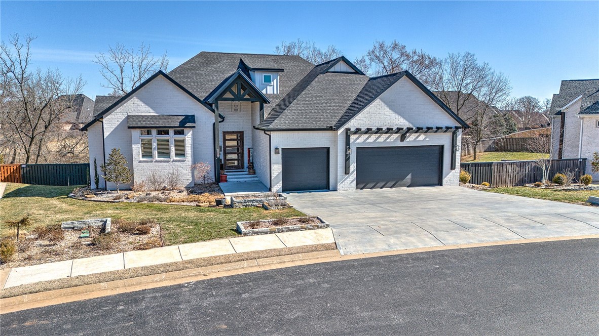 This home is just what you've been waiting for! Gourmet kitchen with large quartz island, custom cabinetry, commercial-style fridge, 5 burner gas range, double ovens and large pantry. Laundry rooms on both levels. Living, dining, office, half bath and master suite on main level. Walkout basement has large bonus/game room, three bedrooms, two full baths and a second laundry room. 2 covered outdoor spaces can be accessed upstairs and down. Awesome fire pit in the back yard that makes for a great gathering spot. Highly sought after Oak Tree community offers resort style pool, tennis, fitness center, playground and clubhouse. Don't miss out in this opportunity to enjoy all this home has to offer.