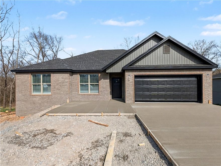 Welcome To Your Next Home! This Brick-Front Beauty Is Like Finding The Last Piece Of Pizza In The Box—Absolute Win! We’re Kicking Things Off With Preferred Lender Rates As Low As 4.875%, Which Is Basically A Love Letter To Your Bank Account. This House Is Built Right With An Upgraded Moisture Barrier To Keep Everything Ship-Shape. Inside, The 9-Foot Ceilings And Vaulted Living Room With Fancy Beams Give You All The Main Character Energy You Deserve. The Kitchen Is Ready For Your Masterchef Era With Custom Cabinets, Quartz Or Granite Counters, And A Bar-Top Island Perfect For Cereal Or Champagne. The Primary Suite Is A Total Vibe With A Tile Shower And Massive Closet. Located In Gravette Schools With Quick Access To I49, You’re Ready To Roll By Mid-March. Still Time To Pick Your Favorites! Grab This Solid Win Before Someone Else Beats You To The Punch! *Deeded As 2 Bed Septic. 3rd Room To Be Considered Office/Bonus Or Other Non-Sleeping Room. Signed Acknowledgment Of Such Required.