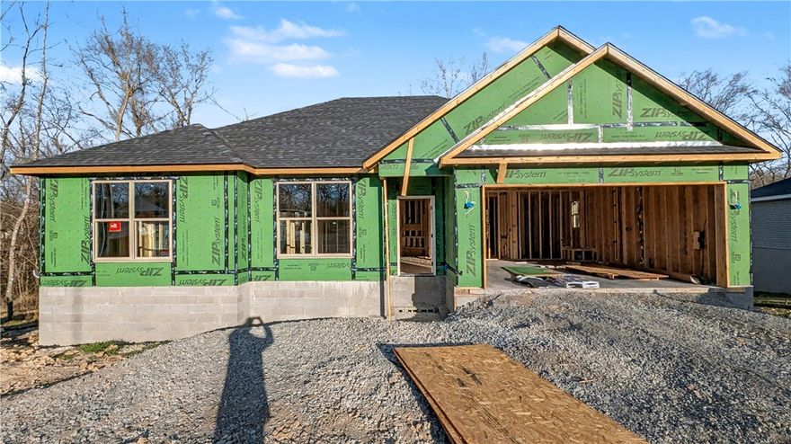 Welcome To Your Next Home! This Brick-Front Beauty Is Like Finding The Last Piece Of Pizza In The Box—Absolute Win! We’re Kicking Things Off With Preferred Lender Rates As Low As 4.875%, Which Is Basically A Love Letter To Your Bank Account. This House Is Built Right With An Upgraded Moisture Barrier To Keep Everything Ship-Shape. Inside, The 9-Foot Ceilings And Vaulted Living Room With Fancy Beams Give You All The Main Character Energy You Deserve. The Kitchen Is Ready For Your Masterchef Era With Custom Cabinets, Quartz Or Granite Counters, And A Bar-Top Island Perfect For Cereal Or Champagne. The Primary Suite Is A Total Vibe With A Tile Shower And Massive Closet. Located In Gravette Schools With Quick Access To I49, You’re Ready To Roll By Mid-March. Still Time To Pick Your Favorites! Grab This Solid Win Before Someone Else Beats You To The Punch! *Deeded As 2 Bed Septic. 3rd Room To Be Considered Office/Bonus Or Other Non-Sleeping Room. Signed Acknowledgment Of Such Required.