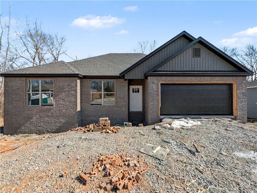 Welcome To Your Next Home! This Brick-Front Beauty Is Like Finding The Last Piece Of Pizza In The Box—Absolute Win! We’re Kicking Things Off With Preferred Lender Rates As Low As 4.875%, Which Is Basically A Love Letter To Your Bank Account. This House Is Built Right With An Upgraded Moisture Barrier To Keep Everything Ship-Shape. Inside, The 9-Foot Ceilings And Vaulted Living Room With Fancy Beams Give You All The Main Character Energy You Deserve. The Kitchen Is Ready For Your Masterchef Era With Custom Cabinets, Quartz Or Granite Counters, And A Bar-Top Island Perfect For Cereal Or Champagne. The Primary Suite Is A Total Vibe With A Tile Shower And Massive Closet. Located In Gravette Schools With Quick Access To I49, You’re Ready To Roll By Mid-March. Still Time To Pick Your Favorites! Grab This Solid Win Before Someone Else Beats You To The Punch! *Deeded As 2 Bed Septic. 3rd Room To Be Considered Office/Bonus Or Other Non-Sleeping Room. Signed Acknowledgment Of Such Required.