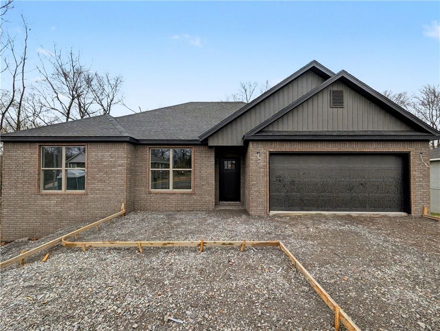 Welcome To Your Next Home! This Brick-Front Beauty Is Like Finding The Last Piece Of Pizza In The Box—Absolute Win! We’re Kicking Things Off With Preferred Lender Rates As Low As 4.875%, Which Is Basically A Love Letter To Your Bank Account. This House Is Built Right With An Upgraded Moisture Barrier To Keep Everything Ship-Shape. Inside, The 9-Foot Ceilings And Vaulted Living Room With Fancy Beams Give You All The Main Character Energy You Deserve. The Kitchen Is Ready For Your Masterchef Era With Custom Cabinets, Quartz Or Granite Counters, And A Bar-Top Island Perfect For Cereal Or Champagne. The Primary Suite Is A Total Vibe With A Tile Shower And Massive Closet. Located In Gravette Schools With Quick Access To I49, You’re Ready To Roll By Mid-March. Still Time To Pick Your Favorites! Grab This Solid Win Before Someone Else Beats You To The Punch! *Deeded As 2 Bed Septic. 3rd Room To Be Considered Office/Bonus Or Other Non-Sleeping Room. Signed Acknowledgment Of Such Required.