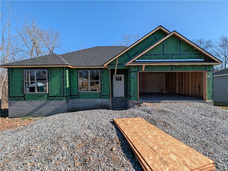 Welcome To Your Next Home! This Brick-Front Beauty Is Like Finding The Last Piece Of Pizza In The Box—Absolute Win! We’re Kicking Things Off With Preferred Lender Rates As Low As 4.875%, Which Is Basically A Love Letter To Your Bank Account. This House Is Built Right With An Upgraded Moisture Barrier To Keep Everything Ship-Shape. Inside, The 9-Foot Ceilings And Vaulted Living Room With Fancy Beams Give You All The Main Character Energy You Deserve. The Kitchen Is Ready For Your Masterchef Era With Custom Cabinets, Quartz Or Granite Counters, And A Bar-Top Island Perfect For Cereal Or Champagne. The Primary Suite Is A Total Vibe With A Tile Shower And Massive Closet. Located In Gravette Schools With Quick Access To I49, You’re Ready To Roll By Mid-March. Still Time To Pick Your Favorites! Grab This Solid Win Before Someone Else Beats You To The Punch! *Deeded As 2 Bed Septic. 3rd Room To Be Considered Office/Bonus Or Other Non-Sleeping Room. Signed Acknowledgment Of Such Required.