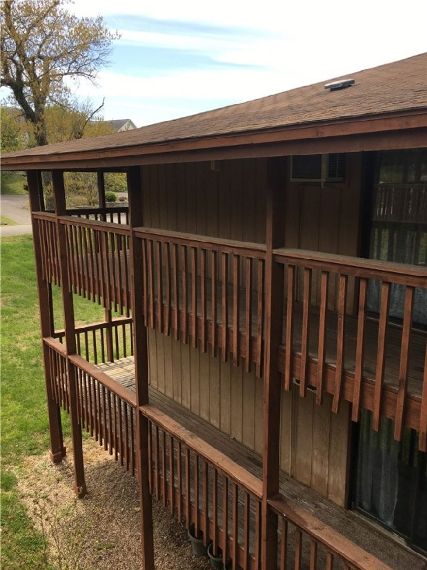 Green Meadow Villa:  18-unit apartment complex on 1.2 acres within walking distance of Table Rock Lake in Holiday Island, close to walking trails, golf course.  Three 6-unit buildings plus laundry facility.  Coin-op laundry and vending could be added for additional income.  Second and third-floor units have a wrap-around balcony.  8" roof overhang on porches minimizes painting and upkeep.   70% new hot water heaters, new toilets, new bathroom flooring and premium kitchen fixtures.  All units are one bedroom, though six of them could be modified into two-bedroom units.  All current tenants are background checked.