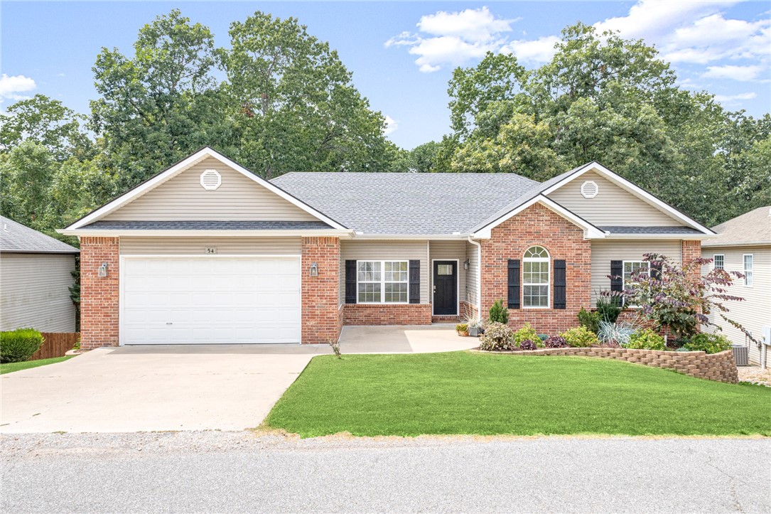 Prime location in southeast Bella Vista, close to multiple golf courses and scenic bike and walking trails. This 4-bedroom, 3 bath home, set among mature trees and on sewer, offers a convenient layout perfect for entertaining. Enjoy a large, partially covered back patio, a covered deck, and a new deck added in 2020. The walkout, fully finished basement boasts 10-ft ceilings and plenty of extra storage with built-in shelving. Recent upgrades include a new roof (2020), wood flooring (2021), full kitchen remodel (2022), new main AC (2022), fresh carpet (2025), interior paint (2025), updated light fixtures, and refreshed landscaping. This move-in ready gem blends comfort, style, and convenience in one of Bella Vistaās most desirable neighborhoods.
