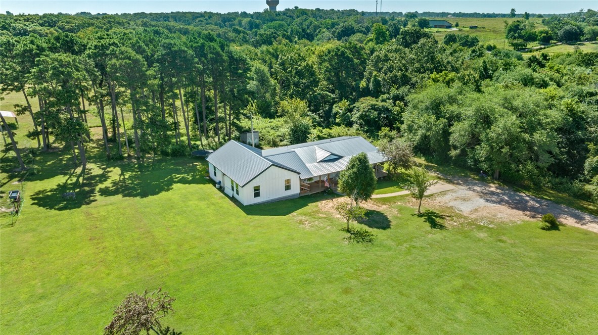 This income producing deal is for you!!! Wonderful multiple home package with opportunity to develop! 5 homes with outbuildings. 40x50 shop & 24x30 barn with a 12x30 lean to on each side & 28x40 barn & 30x40 shop building with a 12x40 lean to on the side included with property. Family tenants at this time but could produce $6,900 per month potentially. Current utilities present include Carroll Electric & Centerton water, currently annexed into Centerton developments are starting soon on adjoining properties. Part of property is expected to have sewer soon, buyer to satisfy themselves on utilities! No deed restrictions! Don't wait, there are homes on the property, minimal value or consideration being provided to residents. However, they are in great condition & being lived in. Could also potentially be perfect for a mini hobby farm. The opportunities are endless! Animals live here- please do not enter without an appointment- seller must make arrangements. Appointment Only! Photos on request! More photos coming soon.