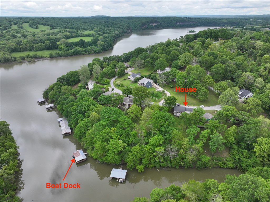 Your Affordable Gateway to Beaver Lake Living with Boat Dock Access!
Discover the charm of lakeside living at 22058 Dogwood Circle in Springdale, Arkansas! This cozy 1128 sq/ft lake house presents a fantastic opportunity to own a piece of the coveted Beaver Lake lifestyle without breaking the bank. Enjoy the convenience of a co-owned boat dock with your own dedicated slip, providing access to the sparkling waters for boating, fishing, and recreation. Potential to ad extra square footage by finishing out the basement. Perfectly positioned with easy access to both Springdale and Fayetteville, this property offers the best of both worlds – peaceful lake living and nearby city amenities. Unwind and soak in the breathtaking sunrises and sunsets from the wonderful back porch, an ideal spot for relaxation and entertaining. Currently operating as a successful Airbnb, this lake house is ready for you to create lasting memories with family and friends on beautiful Beaver Lake.