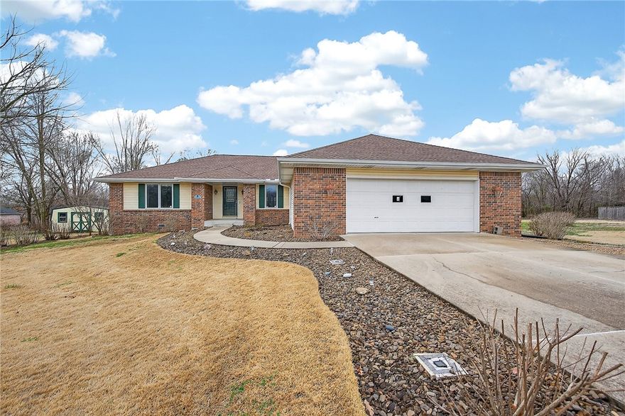 Don't miss this unique opportunity to purchase a home with 2 additional flat lots in Bella Vista--just minutes from Highlands Golf Course, Loch Lomond & I-49! This well-maintained 3 bedroom, 2 bath one-level home offers a split floor plan, pantry, island and built-in desk in the kitchen and a cedar lined closet. Relax in the 3 seasons enclosed porch that has gas & electricity and reinforced for a hot tub and the deck has an electric awning (west facing) for added shade. Other exterior features are a fully landscaped yard with garden beds, water fountain & 16' X 12' storage building with electricity, along with a storm shelter in the oversized 2 car garage.