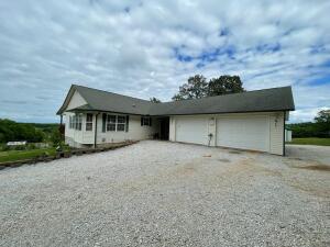 Country living at its best! Sit on the deck to enjoy your view of your pasture and deer. Well built three bedroom, three bath with tons of room throughout the home. Wrap around deck on three sides with 36 acres that you can enjoy. Half of the acreage in pasture and half wooded. Home is wired for a generator. Two ponds in progress. Greenhouse, chicken coop, wild blackberry patches and fruits trees are already set up just waiting for you! This property has many things to offer! Privacy and comfort at its best!