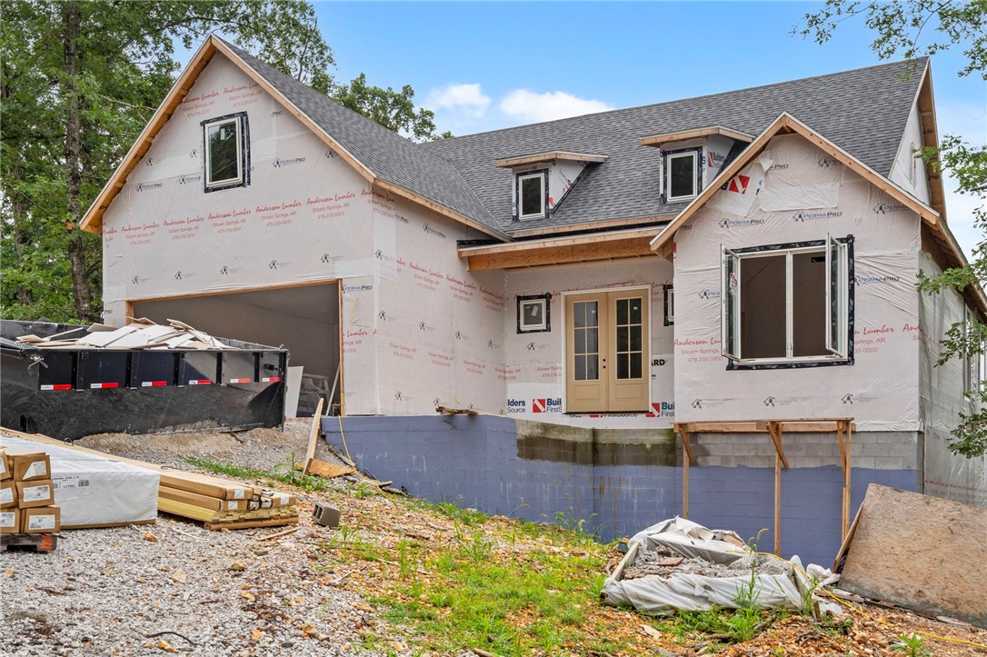 For those who value design, peaceful surroundings, & a lifestyle immersed in nature, this brand-new Golden Key Construction home offers the perfect blend of craftsmanship & serenity. Tucked away on a private cul-de-sac, this retreat sits surrounded by trees & nestled between 2 of Bella Vistaās Back 40 trails. Located minutes from Metfield Golf Complex & the Cycling Skills Park, as well as Lake Ann & Lake Brittany. From the moment you step inside, soaring ceilings, gorgeous beams, & a wall of windows draw your eye to the incredible views beyond ā A large, private back deck invites you to soak in the sights & sounds of nature or entertain guests in style. This home offers 3 bdrms, 2 baths, & a versatile bonus rm complete with a wet bar. The kitchen boasts quartz countertops, abundant cabinetry, & an oversized pantry with a unique pass-through from the garage, making grocery runs a breeze. Youāll also appreciate the generous storage throughout the home along with a large laundry room. Don't wait to come see this one!