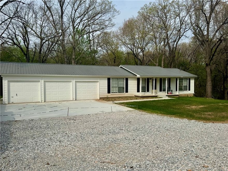 Ranch style home in Springdale fully remodeled - Move-In Ready!  This home has been updated from top to bottom.  Upgrades included brand new deck on back of home 14x49 perfect for entertaining and over looking nothing but nature.  3 Bedrooms 2 baths split BR floorpan.  Large LR with new ceiling fans and new flooring with extra padding.  New HVAC system, new paint inside and out.  2 new garage doors with new driveway, sidewalk that goes to front porch and around to back of home.  New retaining wall and underneath home has new water lines with storage area. Kitchen has new gas range, dishwasher and garage disposal.  Whether you're looking for comfort, style or a great outdoor space - this one checks all the boxes.  Don't miss it!