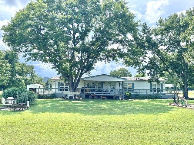 Its country living meets convenience, just a stoneās throw from town! Nestled on 5.63 level acres, centrally located between Bull Shoals Lake, White River, and the Buffalo River - this would make the perfect place to start a mini farm, garden, or just simply enjoy the peaceful, end of the road setting with epic sunrise and sunset viewings from your porch. No restrictions against horses, subdividing, further developing, etc. Formerly farmed as blueberry fields, the usable pasture is plentiful, and the opportunities are vast!