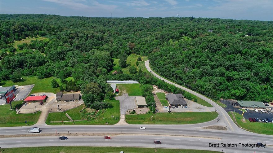 Chance to own rare potential large area commercial property - 8.73 acres on West side of Hwy 71 - office rental and storage unites now on the property.