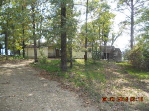 The View will sell this property! 2 homes.Main is open,kitchen, dining, living room, bedroom.2 full baths. 2nd home is unfinished. 2 LARGE storage buildings w/2 carports, 2 sheds. Outbuilding.Covered deck. Use as home or vacation getaway. Semi-secluded w/ a view.Wood burning heater.Window ac. Baseboard elec heat.City water.NOTE: Located out of Clinton, Shirley address
