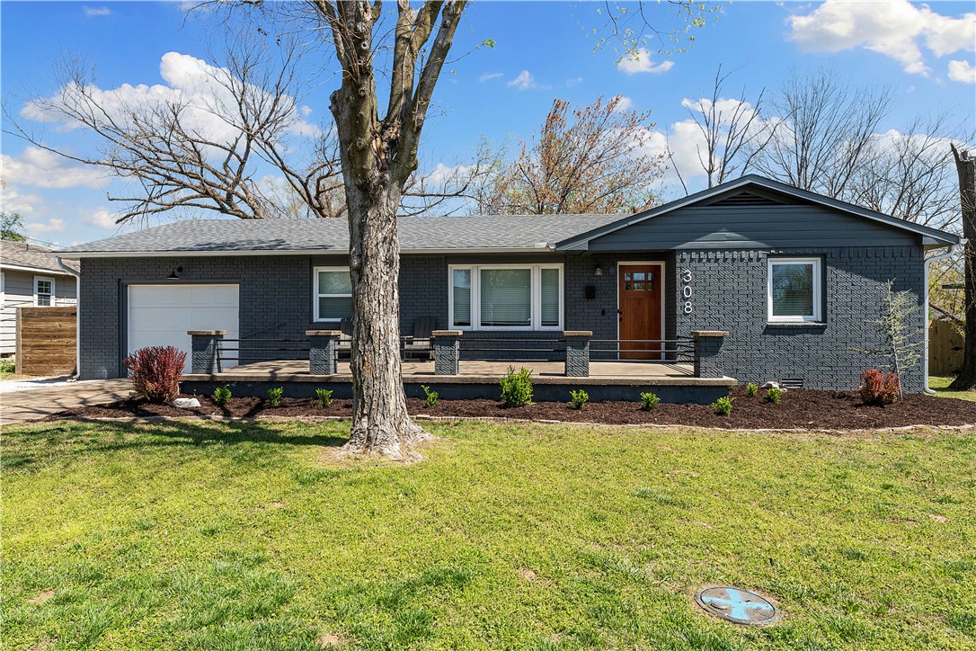 Downtown Bentonville Deal Alert!! This beautifully renovated 4 bedroom (1 flex room/office), 2 full bathroom home sits in a peaceful neighborhood on one of the most desirable streets in town. Tucked away just off of 3rd Street, youāre away from all the traffic, yet less than a mile from the Square and all that Downtown has to offer. Youāre also smack-dab in between the Slaughter Pen and Coler trail systems. This home has been reimagined to offer the perfect blend of modern upgrades and craftsman character. Upon entering, youāll immediately feel the coziness and warmth of the living area which features an abundance of natural light, soft edges, and original hardwood floors. The spacious kitchen features tasteful, two-tone cabinets and tons of counter and storage space. Youāll also enjoy the best front porch in the neighborhood as you soak in the dazzling colors of the Ozark sunset. Roof, windows, ductwork, plumbing, and electrical all upgraded less than 3 years ago. Furnishings are negotiable. Hurry, it wonāt last!