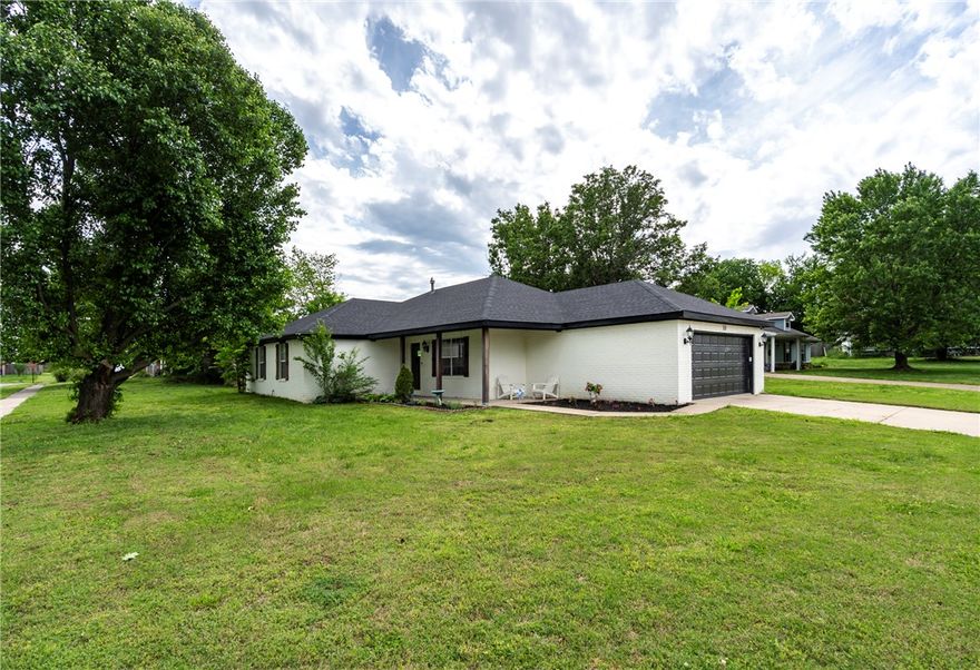 USDA, FHA, and Traditional financing Eligible!! $3,000 Preferred Lender Credit! Inviting all-brick home on a spacious corner lot in beautiful Prairie Grove, Arkansas- just minutes away from top-rated schools and the vibrant downtown area. This 3-bedroom, 2-bath home features vaulted ceilings with a central beam in the living room, plus an updated kitchen with granite counter tops along with two walk-in closets in the Primary bedroom.  Upgrades include a new roof, garage, and appliances- all in 2023. The backyard features a versatile storage building, perfect for a she-shed, hobby space, or extra storage. Move-in ready and nestled in a delightful small town setting- don't miss this gem! Only 12 miles to Fayetteville.