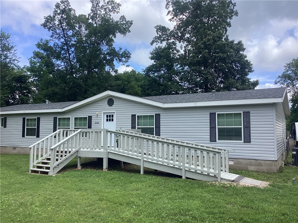 Fall in love with this newly remodeled Double-wide on 3.49 acres. New roof, siding, HVAC and an interior refresh in the last year! Nice new deck and entrance ramp out front that's perfect for families and dogs.
A nicely fenced backyard with a concrete patio for puppers, chickens or your new gardening habit. How about a fresh new gravel driveway and room in this house for your whole family! Come and take a look today before this one is gone! Seller is motivated!
