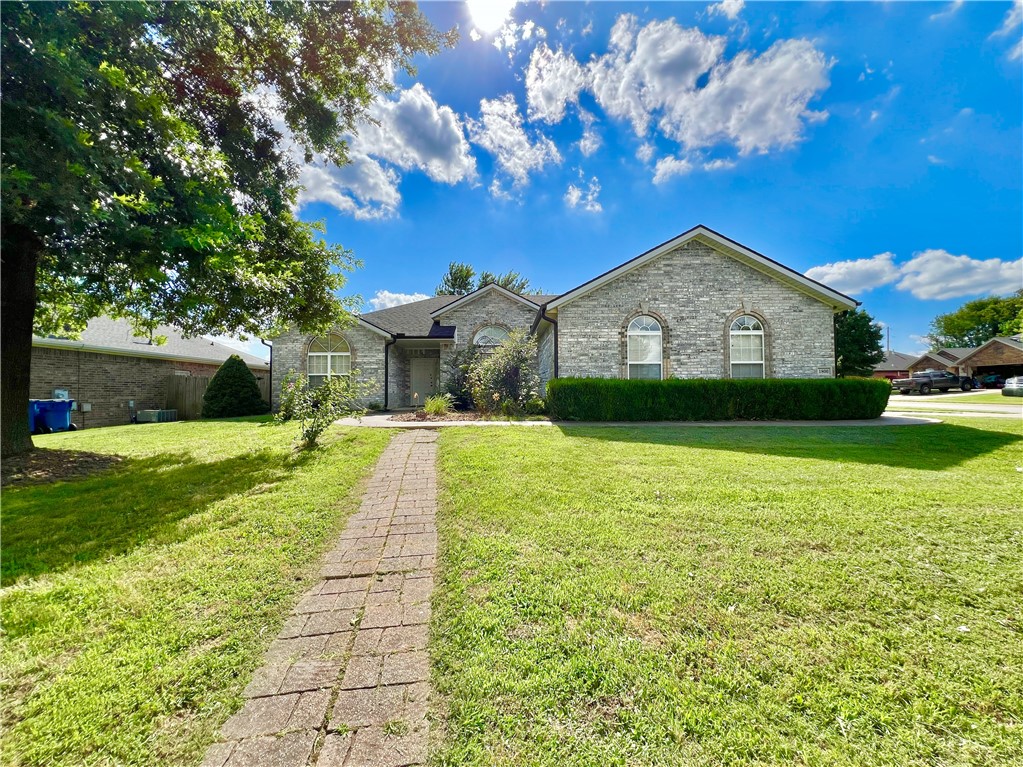 Situated on a corner lot in the sought-after Windwood Subdivision, this all-brick home offers comfort and convenience in the heart of Bentonville’s top-rated school district. Inside, enjoy fresh paint and updated wood laminate and tile flooring throughout—no carpet! The spacious formal dining room is ideal for entertaining, while the primary suite features dual closets and an oversized ensuite with double vanities. Outside, enjoy a fully fenced backyard equipped with fruit trees, raised garden beds, and an 8x10 storage shed. Relax on the West-facing back porch with your morning coffee. Just minutes from the Walmart Home Office, Osage Park, Coler Mountain Bike Preserve, Crystal Bridges, and downtown Bentonville, this home offers easy access to the city’s renowned trails, arts scene, and thriving culinary culture. Experience the best of Northwest Arkansas living in this well-maintained home.