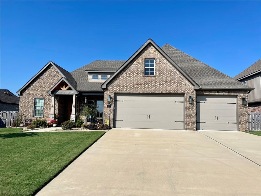 Come take a look at this like new 4-bedroom, 3.5-bathroom home in the Benedetto Subdivision located in Springdale, AR. This open concept floor plan boasts as an entertainer's dream. With a large primary bedroom suite and two additional bedrooms on the main floor, as well as a formal dining room and eat-in-kitchen made for all your guests to gather around. Upstairs you will find an additional guest suite, bonus room, wet bar and ample amount of attic storage. This home will amaze you with the high-quality finishes including beautiful, exposed beams throughout the main level, central-vac system, tankless water heater, irrigation system, air curtain located in garage and much more. Don't forget to slide open the gorgeous ceiling to floor doors and step out onto the back patio that with a click of a button becomes a relaxing screened in oasis.