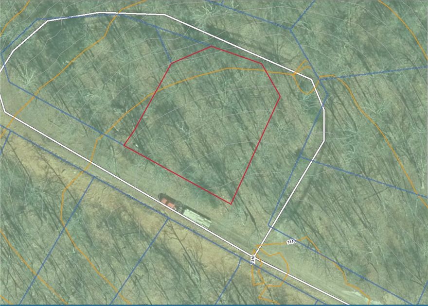 This is a very nice gently sloping lot, suitable for a slab construction. With new construction next door and across the street you will have plenty of good comps to sell for a decent price per sf. Road will be paved in the next year or two according to road department. 

Can send Perc test by request: 
Loading rate: 0.64 gal/ Sq.Ft.
A two bedroom house septic system placed in this soil will require 234 lineal Ft. of lateral field line.
A three bedroom house septic system placed in this soil will require 352 lineal Ft. of lateral field line.