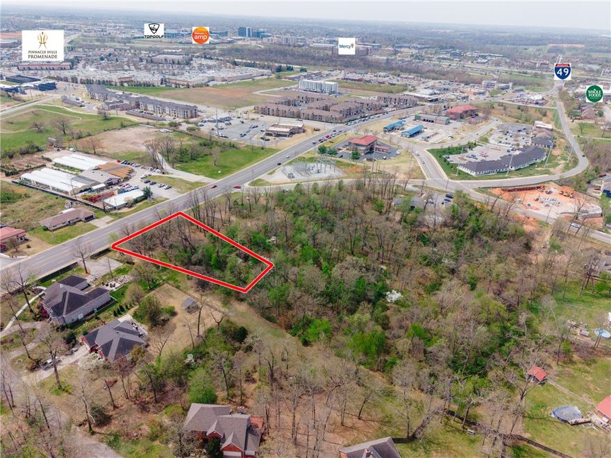 Positioned in one of the most strategic growth corridors of Rogers, this ±0.92-acre commercial parcel offers an exceptional opportunity for business development in a high-visibility, high-traffic location. Approximately 164 feet of frontage along W. New Hope Road and a daily traffic count of over 23,500 vehicles, the site provides outstanding exposure for a wide range of commercial uses. Zoned T4.2, the property allows for flexible development potential. All city utilities available to the site. Convenient location—just one mile east of I-49—ensures seamless accessibility for both local and regional traffic. Surrounded by thriving commercial activity, the property is only minutes from Pinnacle Hills Promenade, placing it near premier retail, dining, recreation, and professional offices as well as Mercy Hospital. Prime positioning makes it ideal for retail, office, or service development. Rare opportunity to secure a highly visible and well-located commercial site in NWA.