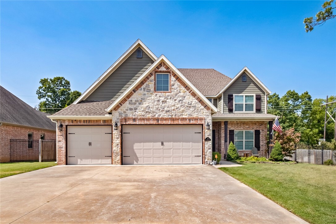 Welcome to White Oak neighborhood! This beautifully maintained 5-bedroom, 3-bath home offers a spacious and versatile layout.
The main floor features an open-concept living area with a cozy gas fireplace, dedicated dining space, and a bright, well-equipped kitchen with ample storage and countertop space. The primary suite is conveniently located on the main level and includes a spa-like ensuite with a soaking tub, walk-in shower, and large walk-in closet. Upstairs, you'll find four generously sized bedrooms and a full bathāideal for guests, kids, or office setups. Unfinished bonus room, can easily be built out for additional space.
Enjoy the outdoors with a large fenced backyard, perfect for play or entertaining. Located walking distance from Elm Tree Elementary and Ardis Ann Middle School, 1.2 miles from Coler Mountain Bike Preserve, 2.8 miles to the Bentonville Square, and 4 miles to the new Walmart Home Office. Enjoy close access to community pool and playground.