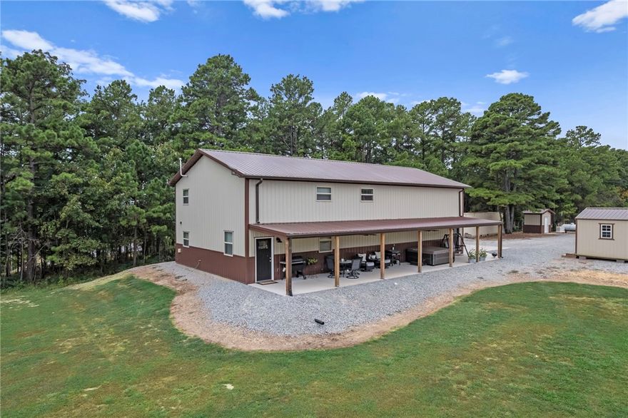 Gorgeous barndominium on a park-like setting minutes to the Clifty Boat Ramp in Eureka Springs, AR! Tucked off the road at 601 County Road 152, this well-kept retreat offers flexible purchase options of 8±, 22±, or 39± acres—bring your dreams, animals, and toys. The 2-bed, 2-bath layout features two living areas for easy entertaining or a home office/media space. An oversized garage provides exceptional storage/workshop potential for boats, UTVs, and equipment. Outdoors you’ll find manicured grounds that truly feel like a private park, plus a travel-trailer/RV hookup for guests or adventure-ready weekends. Enjoy quiet country living with quick access to Beaver Lake recreation fishing, boating, and swimming just about 5 minutes away—while still close to the dining, arts, and charm of historic Eureka Springs. A rare NWA find that blends low-maintenance living with room to grow, buy the home on 22± acres, add more land now, or secure the full 38± acres for your private estate or hobby farm.