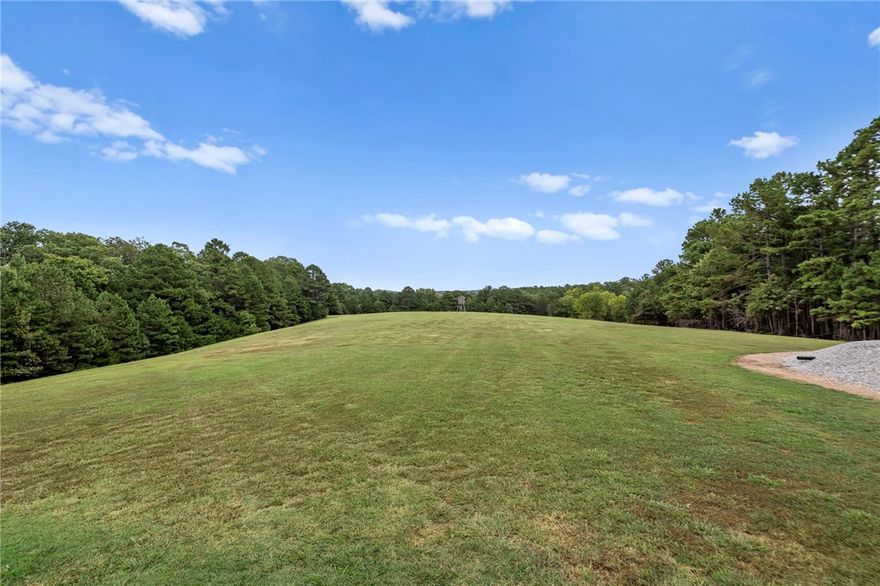 Gorgeous barndominium on a park-like setting minutes to the Clifty Boat Ramp in Eureka Springs, AR! Tucked off the road at 601 County Road 152, this well-kept retreat offers flexible purchase options of 8±, 22±, or 39± acres—bring your dreams, animals, and toys. The 2-bed, 2-bath layout features two living areas for easy entertaining or a home office/media space. An oversized garage provides exceptional storage/workshop potential for boats, UTVs, and equipment. Outdoors you’ll find manicured grounds that truly feel like a private park, plus a travel-trailer/RV hookup for guests or adventure-ready weekends. Enjoy quiet country living with quick access to Beaver Lake recreation fishing, boating, and swimming just about 5 minutes away—while still close to the dining, arts, and charm of historic Eureka Springs. A rare NWA find that blends low-maintenance living with room to grow, buy the home on 22± acres, add more land now, or secure the full 38± acres for your private estate or hobby farm.