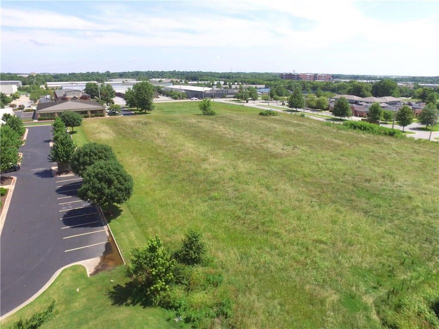 4.43 Acre Commercial land across the street from Northwest Medical Center and just 2 blocks from Sam's Club home office also just down the street from the New Wal-Mart General Office Campus.  Perfect for new offices to be built on.  Level and zoned commercial already.  Also available to purchase in small pieces if needed.