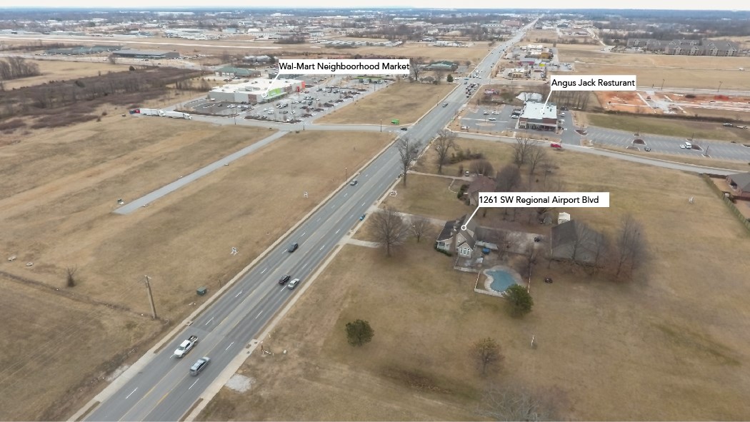 Prime commercial location in up-and-coming sw Bentonville! Located across from the neighborhood market along with a variety of other businesses including restaurants, dentistry, mercy clinic, mcdonalds, and much more! Also close to schools and the bentonville community center! The high traffic count is acccented by close proximity to the Walmart distribution centers and the regional airport! The home and outbuildings on the property will not be shown without an offer per seller's request. A location like this is hard to find! This property is also listed as land ML# 1105241