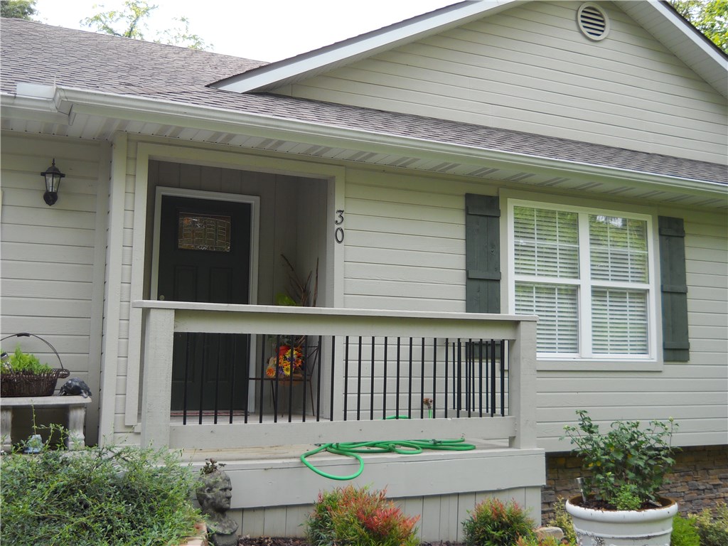 Unusual to find such quality under $110/sqft for a 4 year old home- Wonderful custom kitchen with granite - lots of cabinets plus a mud room and pantry - open floor plan with corner gas fireplace - three bedrooms plus an office or craft room - delightful sunroom (incl in GLA) with winter Lake view - laundry room in bedroom wing - good storage - three rear decks - two with pergolas incl one off master bedroom- detached 16x16 shed/workshop with electric - builder/owner moved to new home - this home just feels good and lives well !