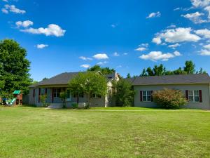 Spacious & inviting best describe this large family home w/ in ground saltwater pool and pool house located on the edge of Clarksville on nearly 3 acres. Many updates including exterior paint, roof, flooring, dishwasher, pool liner 2 yrs. old, kitchen cabinets, & much more. Spacious w/ 2 master suites, walk in closet, bonus room, & large laundry. Vaulted living room ceilings, fireplace, & built-ins. The main master offers 2 closets,double vanities, & Jacuzzi tub. Call today to schedule to see this inviting home!!!