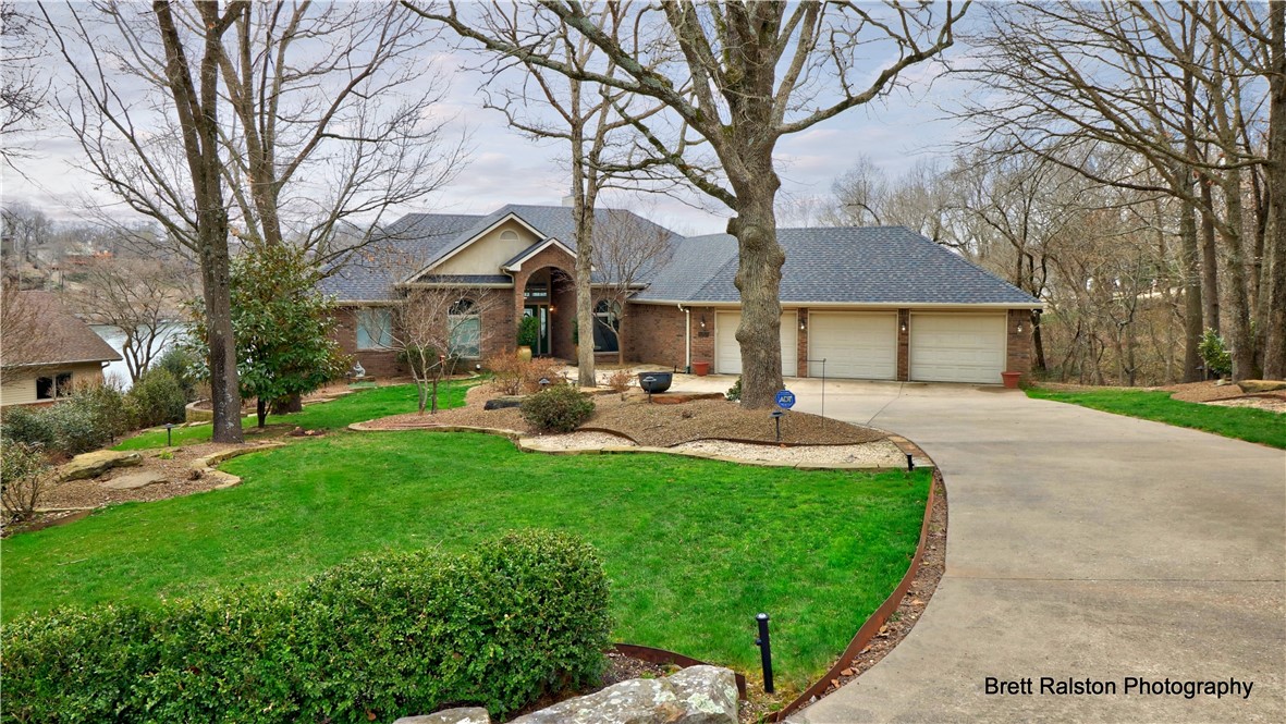 Fabulous lake views from almost every room in this home. Beautifully landscaped lot. Easy walk to the lake. Stunning Kitchen, island, wet bar, Advantium oven, refrigerator conveys. Prep sink. Walk in pantry.
Real wood floors. Beautiful master suite. Great room and bar on the lower floor. 2 Bedrooms with Jack and Jill bath. Extra Storage, private dock. Professionally landscaped. New roof 2019. Newer HVAC (replaced 2017 & 2019) Newer water heater.
