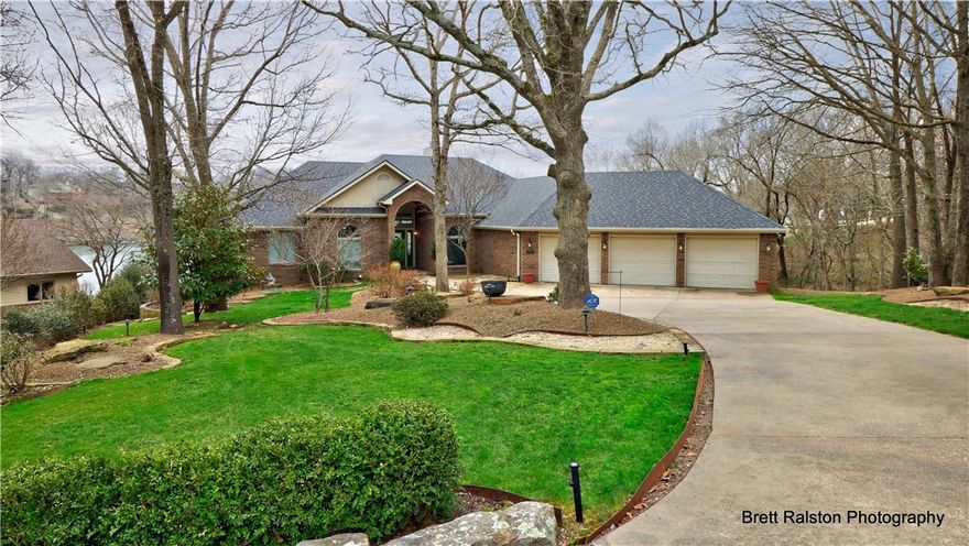 Fabulous lake views from almost every room in this home. Beautifully landscaped lot.  Easy walk to the lake.  Stunning Kitchen, island, wet bar, Advantium oven, refrigerator conveys. Prep sink. Walk in pantry.
Real wood floors.  Beautiful master suite.  Great room and bar on the lower floor. 2 Bedrooms with Jack and Jill bath.  Extra Storage, private dock. Professionally landscaped.  New roof 2019. Newer HVAC (replaced 2017 & 2019) Newer water heater.