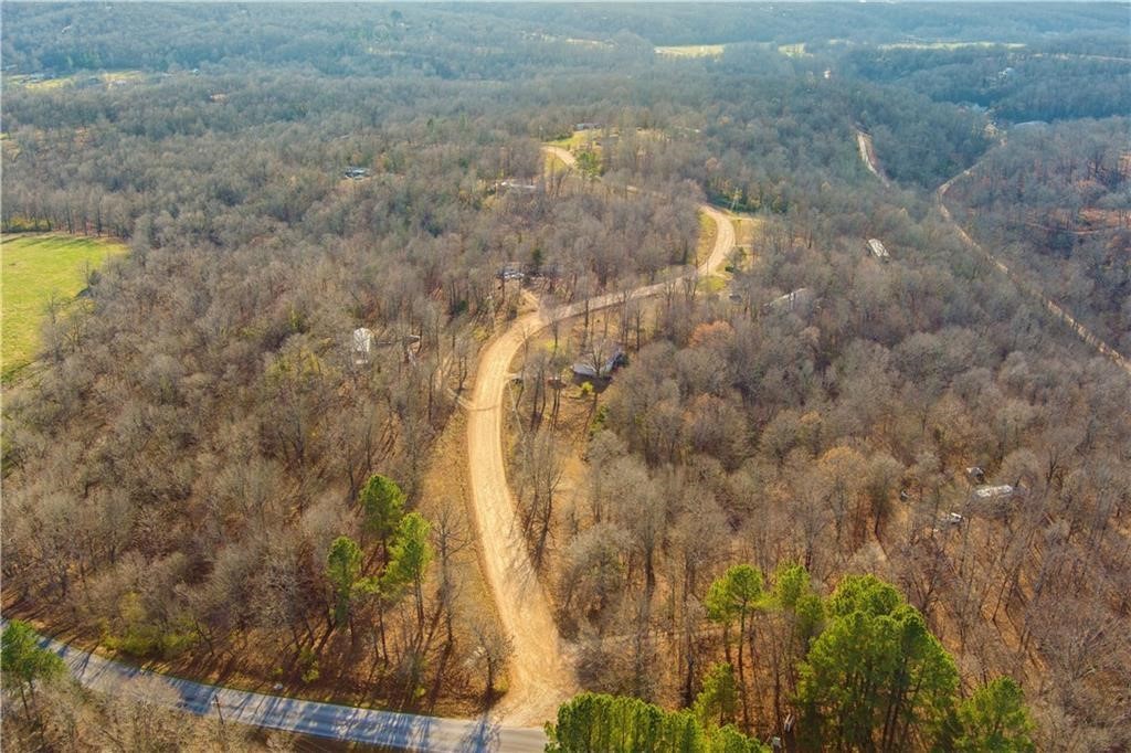 Stunning 2.7-acre property that is primed for building. Cleared land, which creates endless possibilities for building a dream home, create a private retreat, or invest in land with long-term potential. It has septic, well-water, and rural water tap that is paid for.