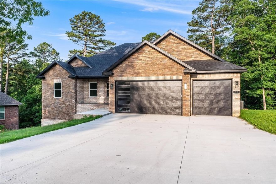 Location, Location, Location! East Bella Vista new construction home, three minutes from 71-B/Bella Vista Way. Near the Back-40, and Flo Ride Bike Trails. Lake Norwood is five minutes south. Also, Walmart Supercenter is a few minutes across the Missouri State Line, The Berksdale Golf Course and Country Club are also a few minutes away. Bella Vista offers more value for your dollar than any other city in Northwest Arkansas. Golf, Tennis, Swimming, Gyms, Shooting Ranges, Fishing, etc... Come and see this beautiful home. All solid brick construction, with a back porch and a nice-sized wood deck. Spacious living room, bedrooms, and a massive garage, with huge attic storage. All surrounded by beautiful woods, with a very nice and wide buffer POA zone to the back that affords even more privacy in this tranquil cul-de-sac nice-size lot. Comes with a one-year builder's warranty.