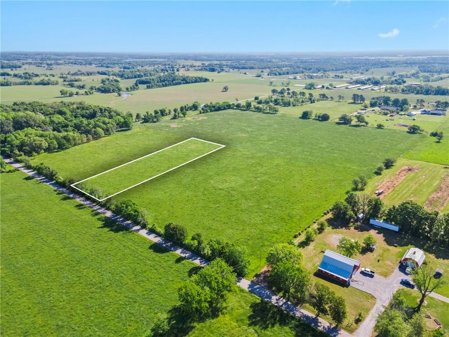 Just 10 minutes from the Northwest Arkansas airport, discover an exclusive opportunity to claim 2.03 acres of pristine, flat land where elegance and tranquility meet. This rare gem offers uninterrupted views of both sunrise and sunset, creating a breathtaking backdrop for a lifestyle of refined comfort and serenity. The land stretches wide and open beneath a vast sky, inviting you to dream without limits. Imagine a custom estate tucked into the peaceful landscape—grand entrances, sleek architecture, manicured grounds, and sophisticated outdoor spaces designed for hosting under the stars. Whether you’re envisioning a modern sanctuary or a timeless retreat, this land provides the foundation to build your legacy. Privacy, beauty, and convenience converge in one exceptional location—close to everything, yet far enough to feel like your own private escape. Your future deserves a setting this extraordinary. Let luxury begin here.