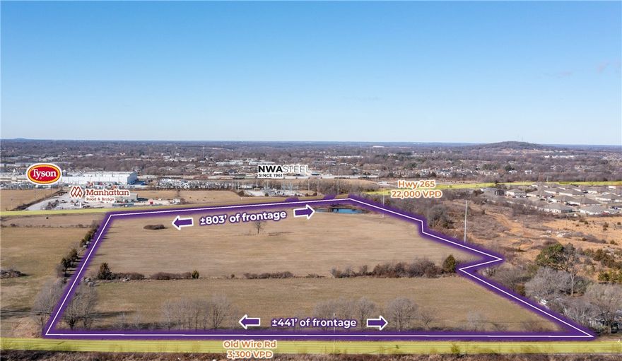 This high-visibility property offers exceptional exposure with approximately 803 feet of frontage along Highway 265, traveled by 22,000 vehicles per day, and an additional 441 feet along Old Wire Road, which sees 3,300 vehicles per day—providing outstanding daily traffic counts, prominent signage potential, and clear visibility from Springdale’s primary industrial corridor. Centrally positioned within the Northwest Arkansas MSA, the site offers strategic regional access just 4.5 miles from Interstate 49 and 1.4 miles from Highway 71B. The property also provides flexible development options, as it can be subdivided into smaller tracts with a minimum size of three acres. With level topography and access to water and electric utilities from Old Wire Road, the site presents an excellent opportunity for commercial or industrial development.