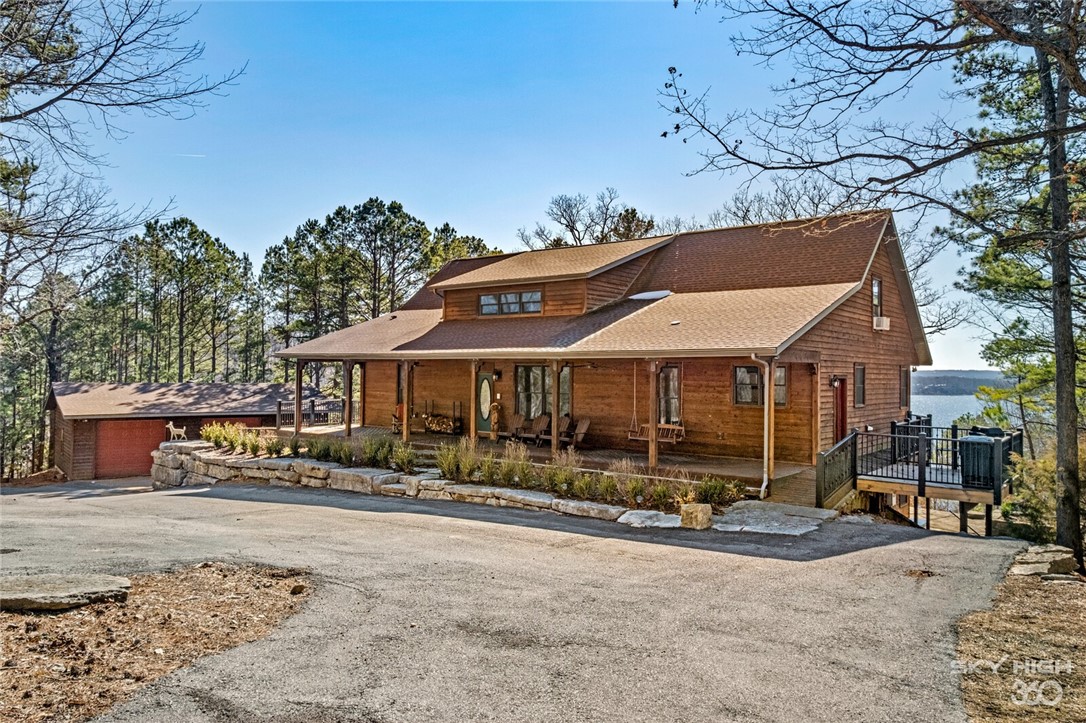 Escape to your private oasis nestled on over 7 acres and with fabulous Beaver Lake frontage! Open floor plan, 5 bedrooms, 3.5 baths, 4 car garage, multiple living areas, walk out basement and plenty room to entertain! Fresh paint, new flooring, new modern light fixtures, new hot tub, and new lift. Multiple patio areas overlooking year round picturesque views of Beaver Lake. Easy access by steps or ATV trail directly to core line to your private boat dock with 2 slips/lifts, swim deck and all located on quiet & serene cove!