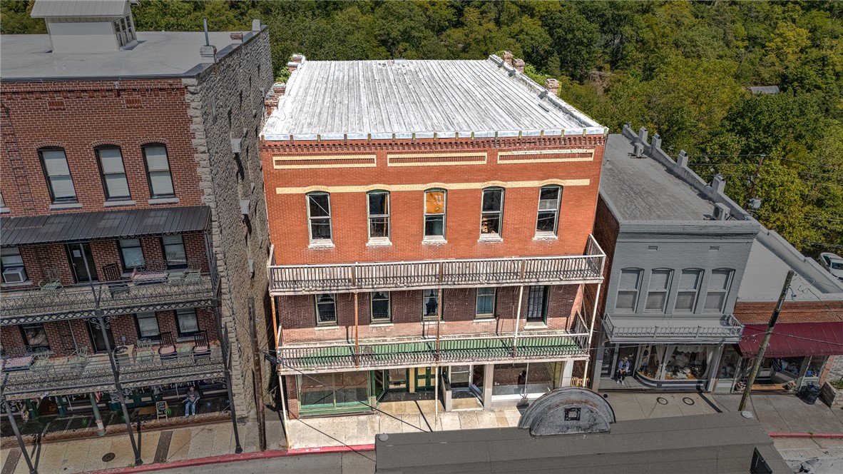 Rare opportunity to own one of the largest and most prominent commercial buildings located directly in the heart of historic downtown Eureka Springs. 53 & 55 Spring Street Built in 1905. This multi-story building sprawls across 13,056 square feet with 5 levels, on two primary street addresses located both on Spring and Center Street. The property offers an exceptional opportunity with high visibility and maximum foot traffic. Situated near the New Orleans Hotel, Basin Park Hotel, the Palace Hotel & Bath House, and surrounded by art galleries and specialty shops. With an option to lease up to four parking spots. There are two Center Street storefronts, four spaces on the mid level, two huge store fronts on Spring Street and there's endless development potential for the approximately 6,000 square foot top two stories. Don't miss out on this chance to be a part of Eureka Springs history. Schedule a viewing today!